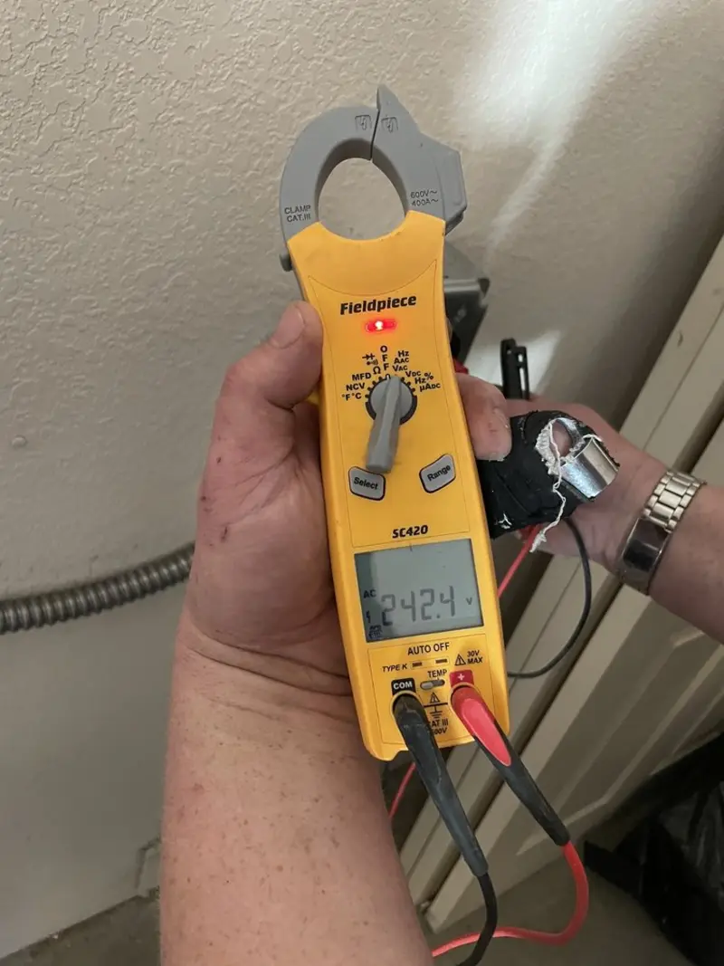 Voltage testing with clamp meter during Outlet Installation in Suffield